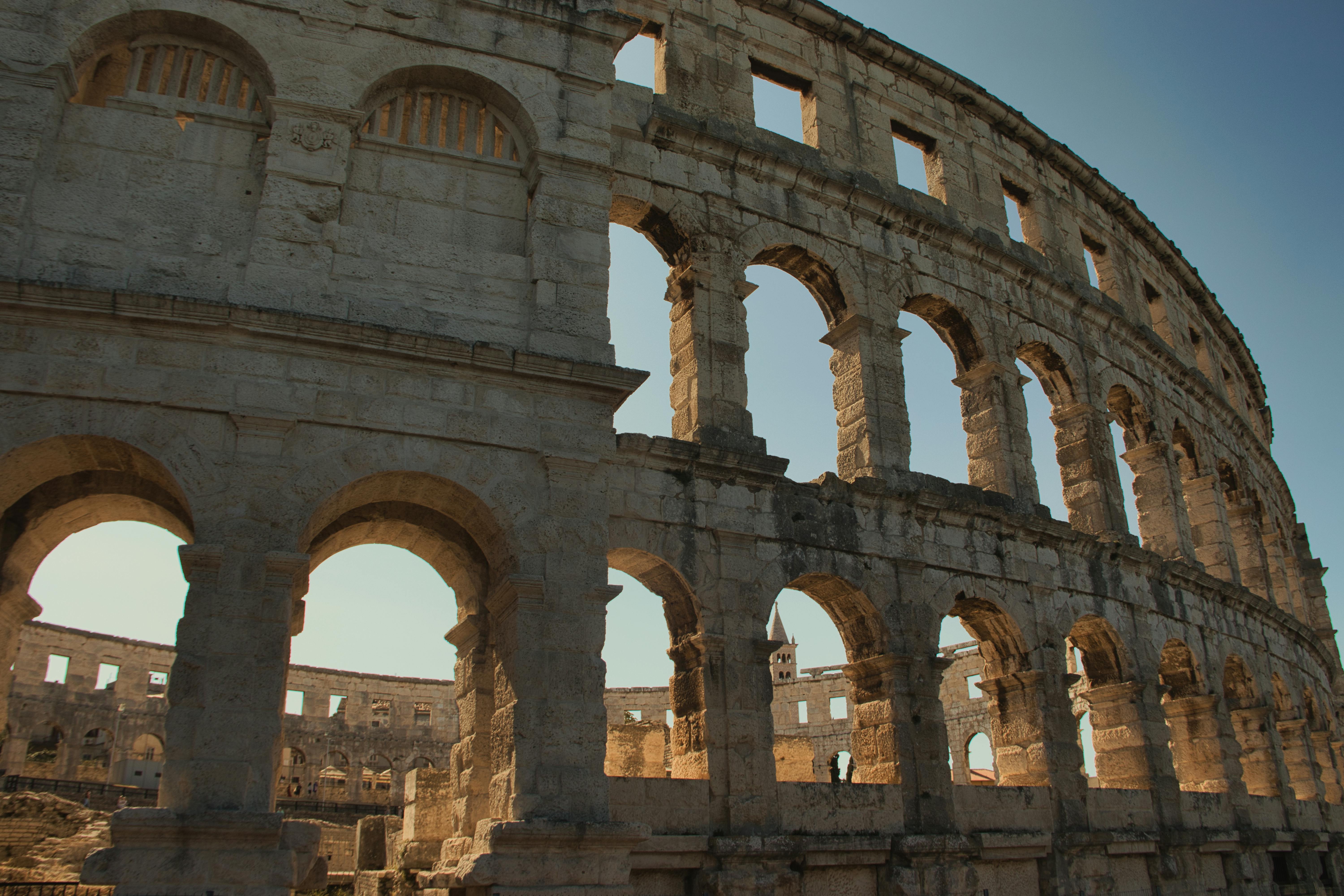 Discover the ancient Pula Amphitheater architectural marvel in Croatia, beautifully captured in daylight.